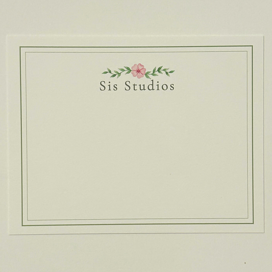 A square cream-colored notecard with a thin double-line border, featuring the text custom personalization with small pink flower and green leaves