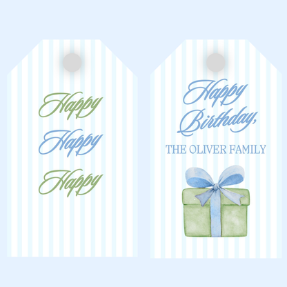 Birthday gift tag with Happy Birthday text and a gift box on a light blue stripe background.