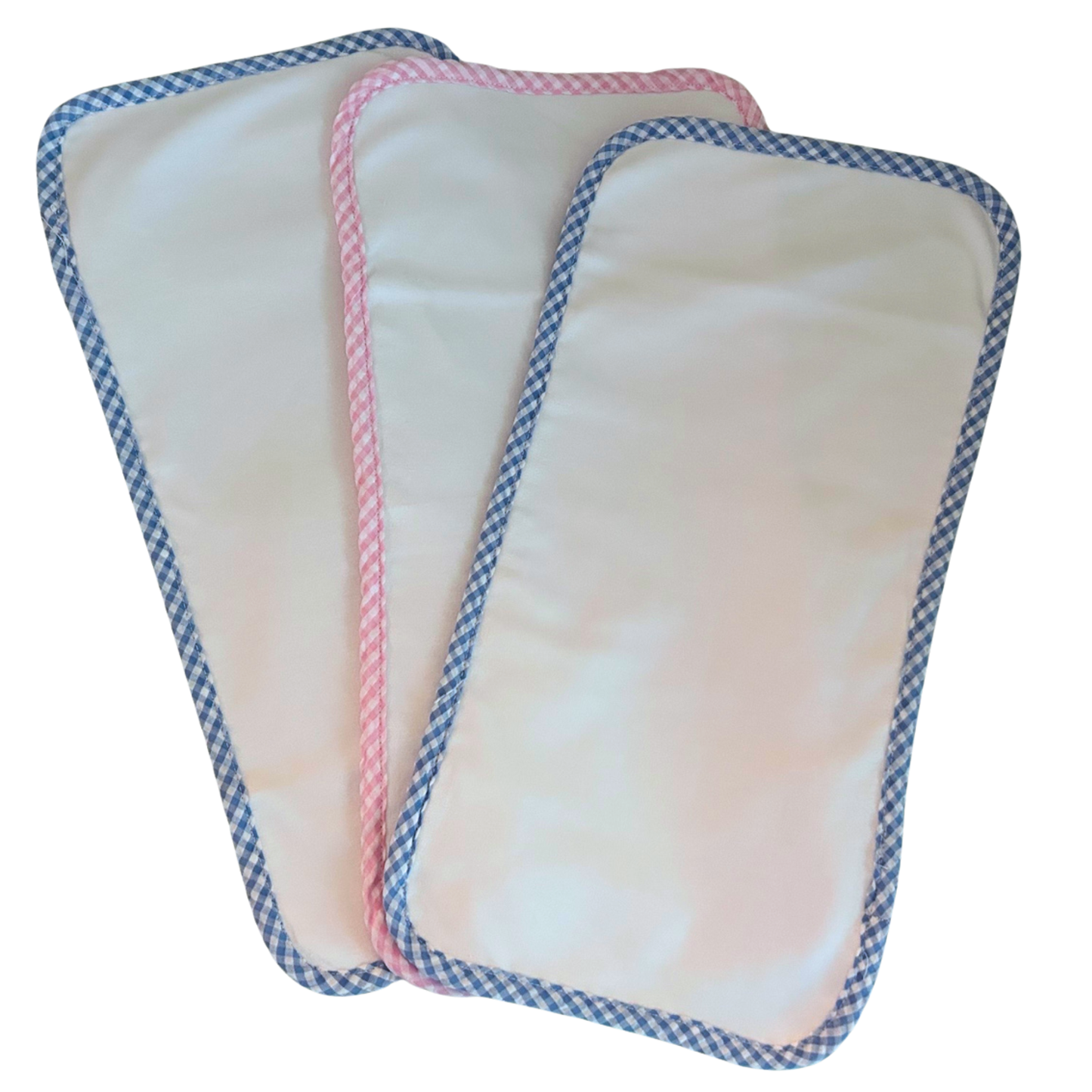 Three rectangular baby burp cloths with with blue and white gingham border, and a pink and white gingham border,