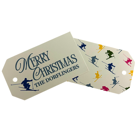 Personalized Christmas skier gift tags with a cream background and coordinating skier pattern