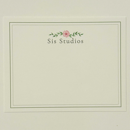 A square cream-colored notecard with a thin double-line border, featuring the text custom personalization with small pink flower and green leaves