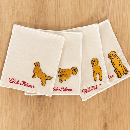 Set of four linen napkins with golden retrievers dog illustrations and personalized name and a white border