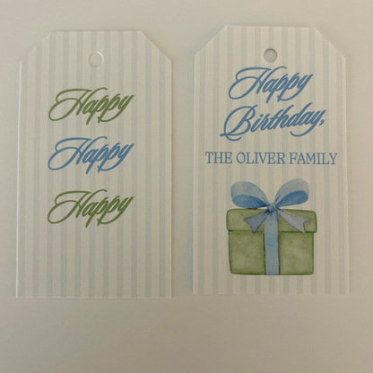 Personalized birthday tags with a white and light blue stripe pattern with green and light blue script and a watercolor style gift