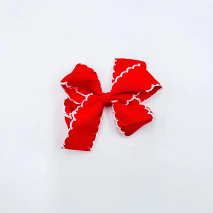 Red bow with white trim 