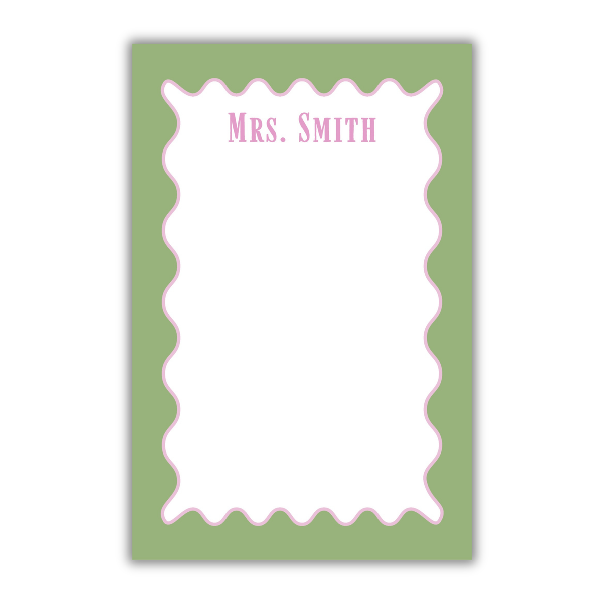 A personalized notepad with a sage green border, a white writing area, a pink scalloped inner border, and the text 'Mrs. SMITH' printed at the top in pink, shown on a white background.
