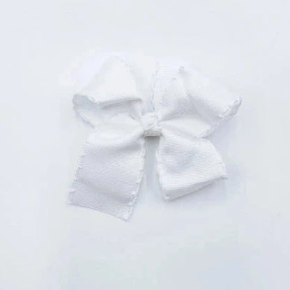 A small white bow with trim