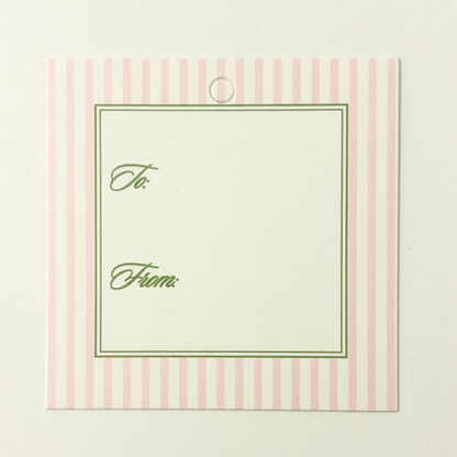 A square gift tag with a pink and white striped border, featuring a cream center panel with green double-line framing and the words 'To:' and 'From:' in green script.