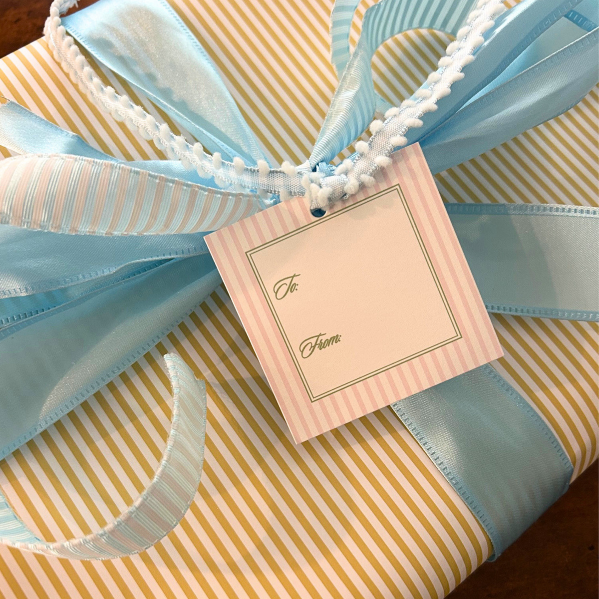 pink gift tag with green details for elegant gift wrapping