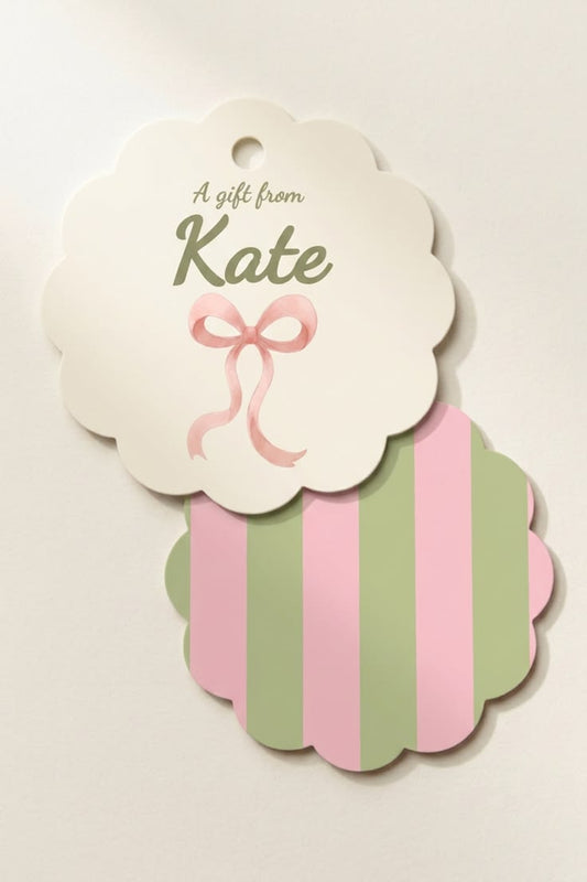 Personalized scallop gift tag with pink and green bow design, featuring custom name on high quality paper for gift giving 