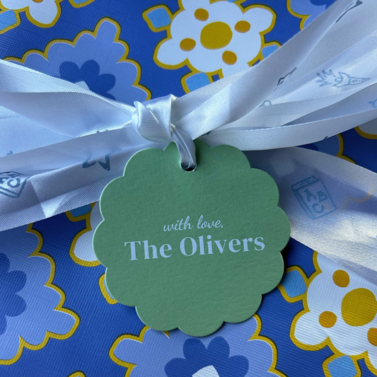 Personalized decorative gift tags on premium paper, featuring custom name on high quality paper on ribbon with wrapping paper 