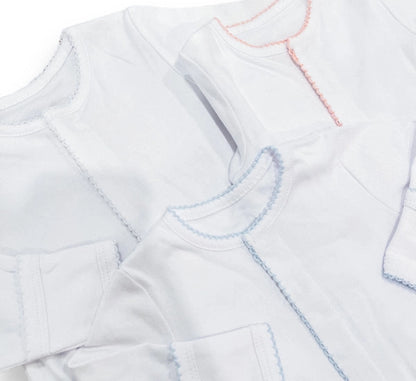 Close-up of a white onesies with embroidered picot trim